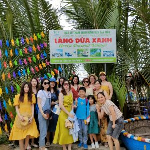 A group visiting Green Coconut Village in Vietnam