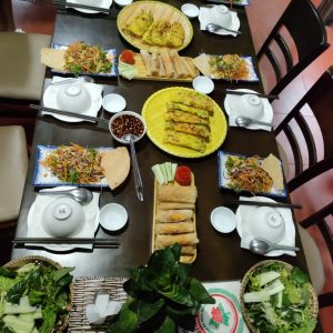 Traditional Vietnamese meal served on a wooden table.