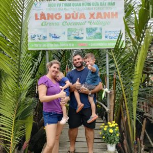 Family visiting Green Coconut Village in Vietnam