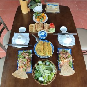 Traditional Vietnamese meal served on a wooden table.