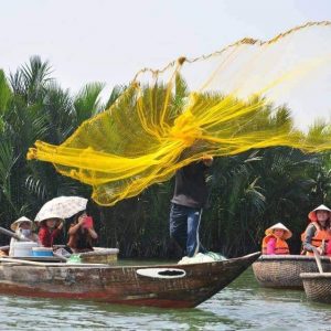 Basket boat tour with local fisherman casting a net in Hoi An