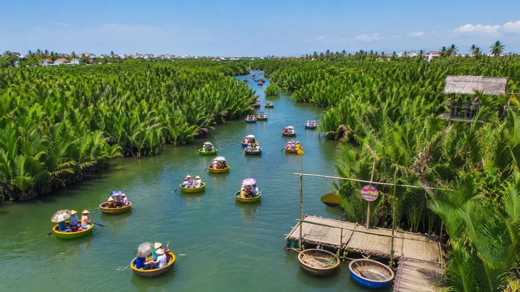 Panoramic view of Hoi An Coconut Forest with many basket boats carrying tourists along the river