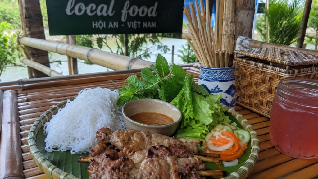 Best Cam Thanh Coconut Village Tour for a Unique Hoi An Experience 8 Local Vietnamese food platter served at a Cam Thanh riverside restaurant.