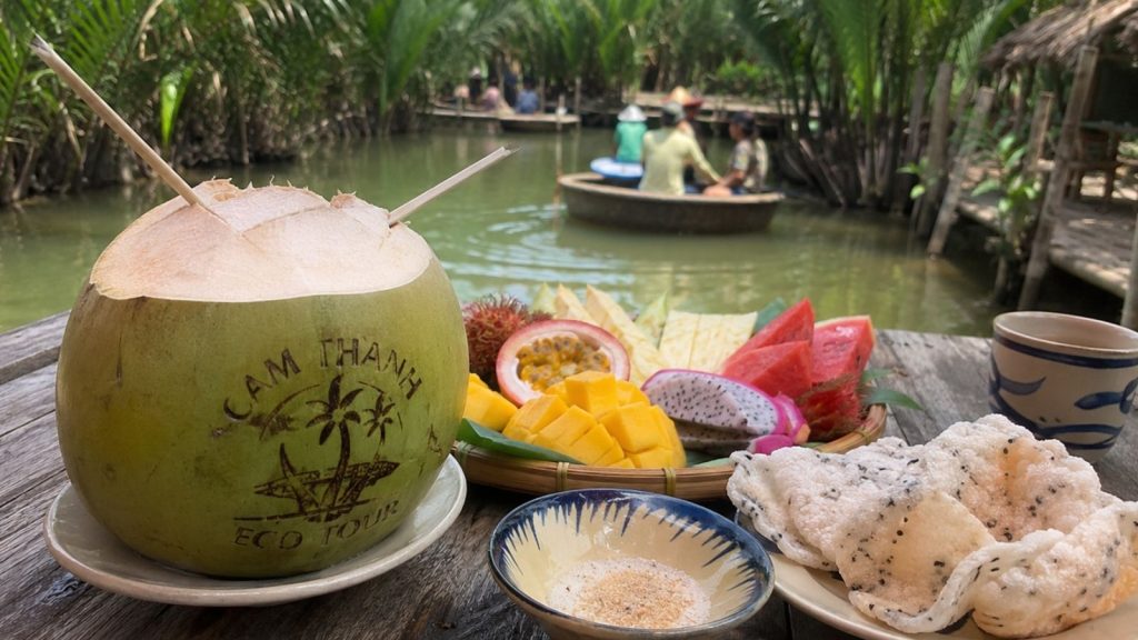 Best Cam Thanh Coconut Village Tour for a Unique Hoi An Experience 9 Fresh coconut and tropical fruit served beside the Cam Thanh waterway.