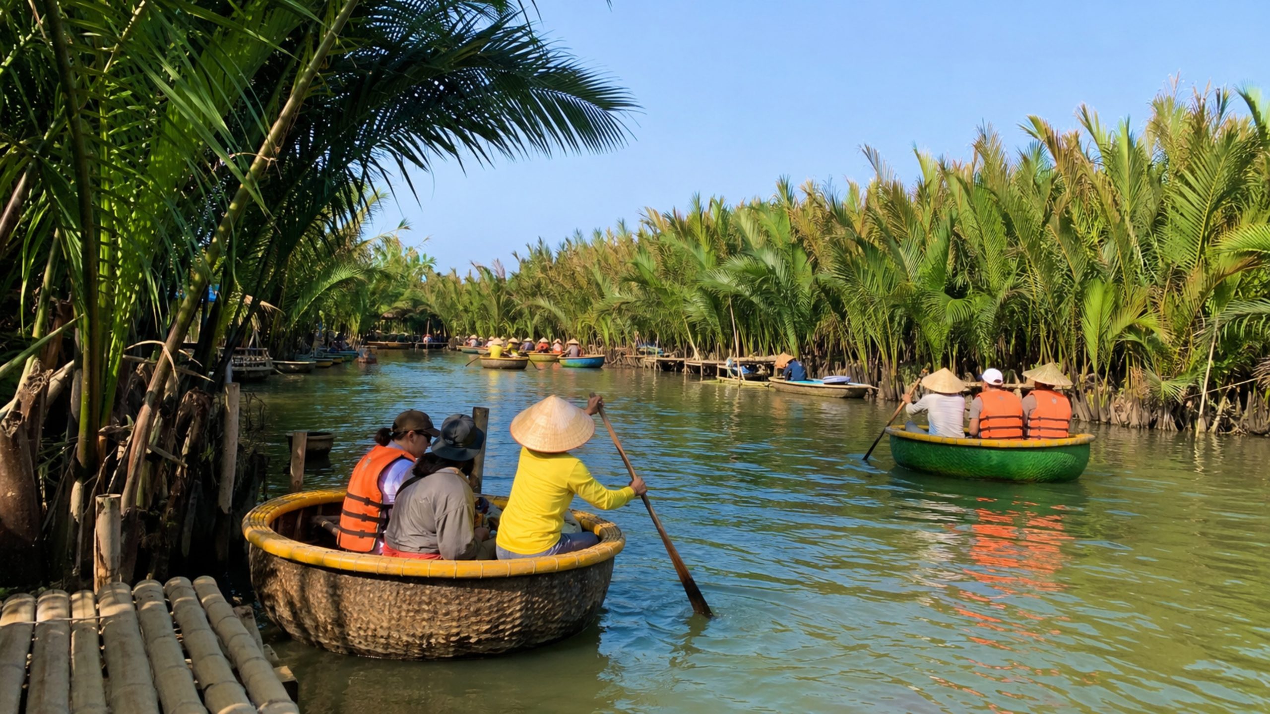 Tourists riding traditional basket boats along peaceful waterways in Bay Mau Coconut Forest.