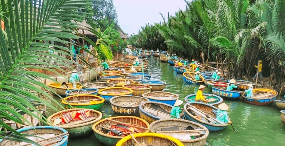 Coconut Boat Tour and Cooking Class Combo Hoi An Guide 2 Guests on basket boat river tour through nipa palm coconut forest in Cam Thanh before the cooking class segment of the combo tour