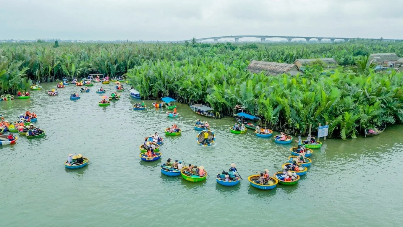 Cam Thanh Village Bicycle Tour: Riding Through Coconut Palm Trails 2 Cyclist arriving at Lang Dua Xanh private river dock in Cam Thanh to begin basket boat tour after cycling from Hoi An