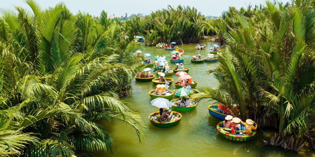 Scenic view of Cam Thanh water coconut village with nipa palm forests and basket boats on peaceful river in Hoi An