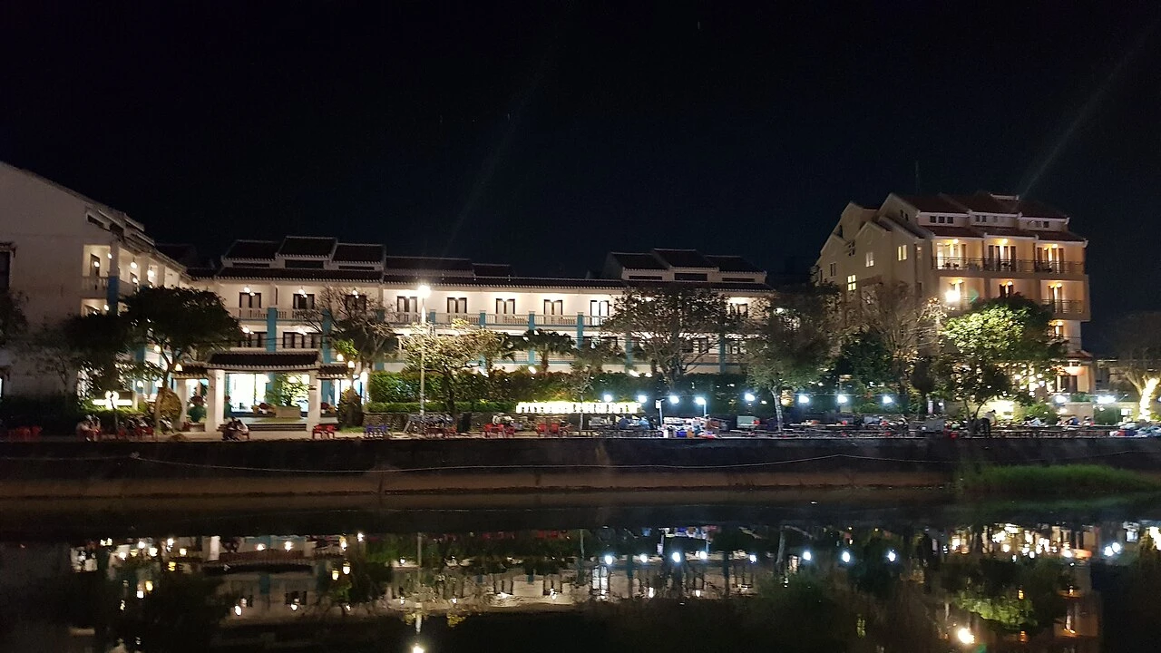 Is One Day Enough to Visit Hoi An? Itinerary & Travel Guide 4 Hoai River glowing with candlelit paper lanterns and riverboats in Hoi An at night