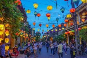 Glowing silk lanterns lining the ancient yellow-walled streets of Hoi An UNESCO World Heritage Ancient Town at night