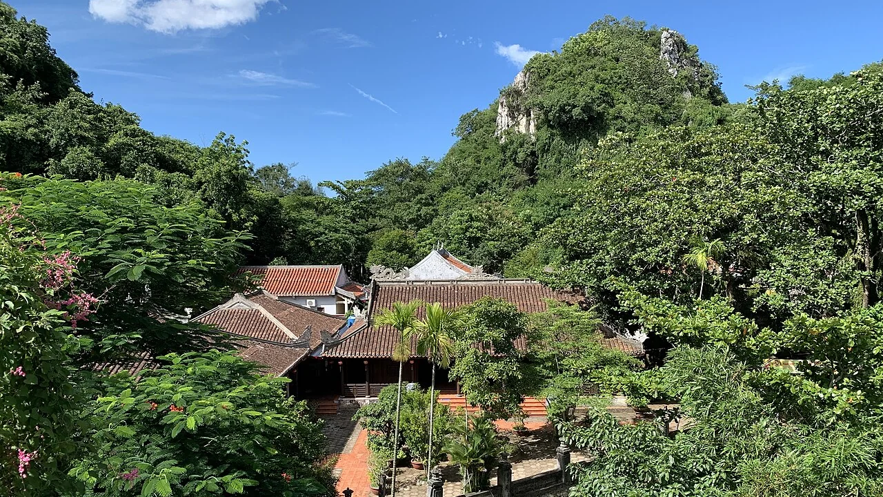 Tourists exploring Buddhist temple complex on Marble Mountains in Da Nang