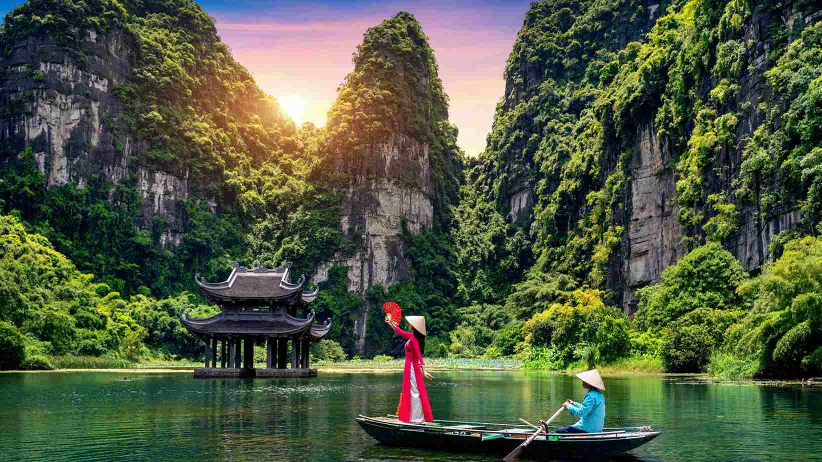 Couple enjoying a private basket boat tour through serene nipa palm canals in Cam Thanh coconut forest Hoi An