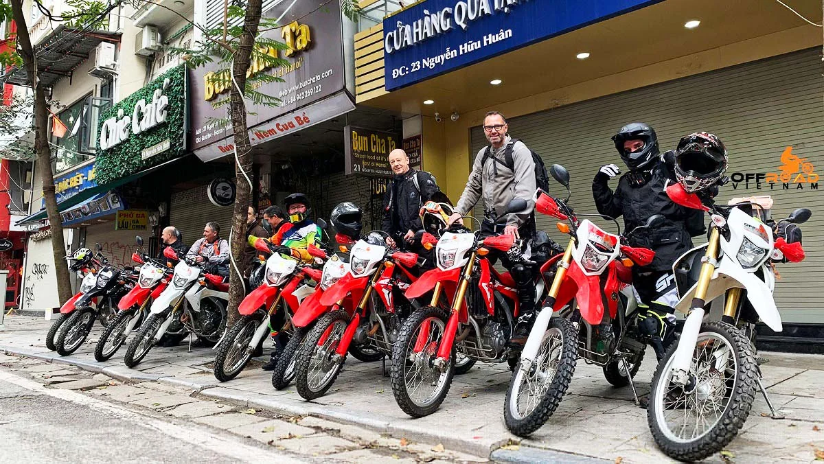 Motorbike and scooter rental shop in Da Nang with rows of automatic Honda Wave scooters available for tourist hire