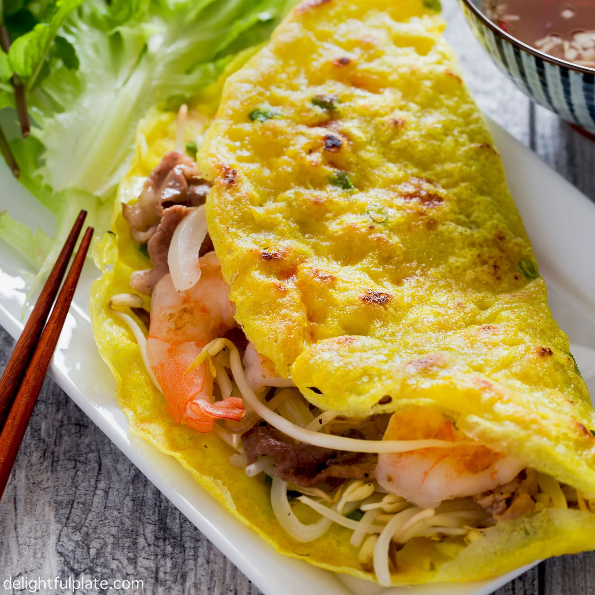 Coconut Boat Tour and Cooking Class Combo Hoi An Guide 3 Traditional Vietnamese Banh Xeo sizzling crepe and Cao Lau noodles being prepared in Hoi An cooking class setting
