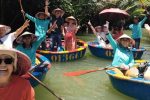 Tourists Waving Oars on Coconut Basket Boat